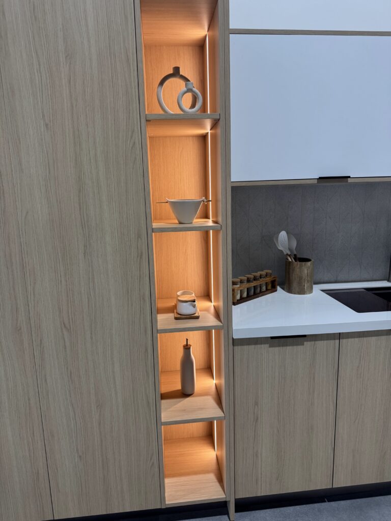 Tall cabinetry with illuminated open storage