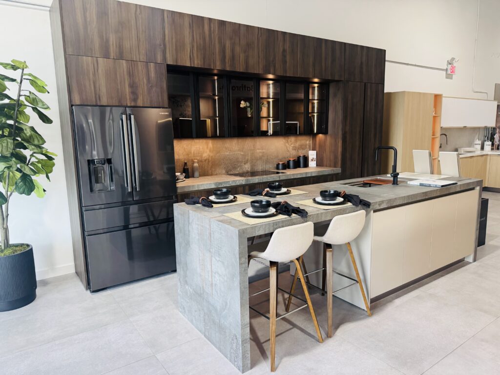 Kitchen cabinetry with an island, seating and integrated lighting